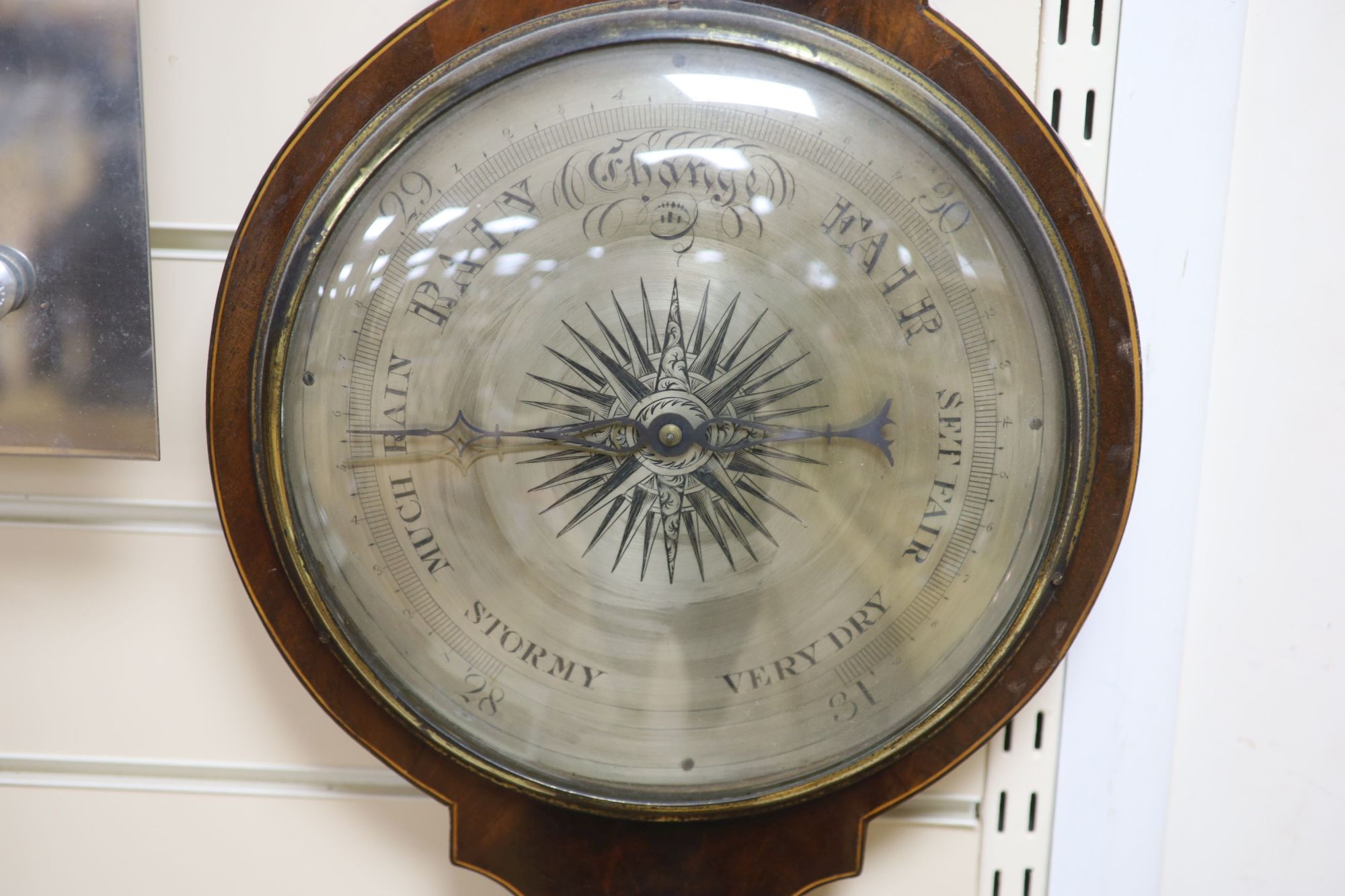 Ciceri and Co., London. A Regency inlaid mahogany wheel barometer and thermometer, length 119cm